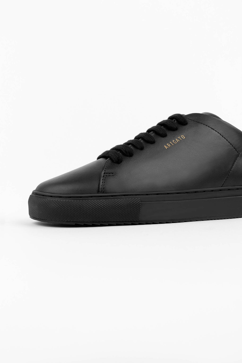 Low-Top Sneakers in Certified Leather with Gold Accents